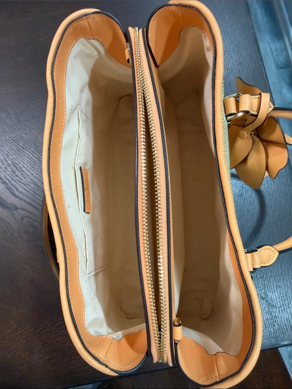 Thompson Street large Kate Spade satchel. Straw with leather orange trim.